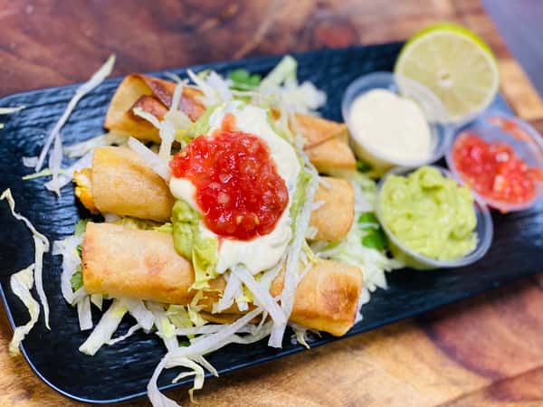 plate of tamales with dips