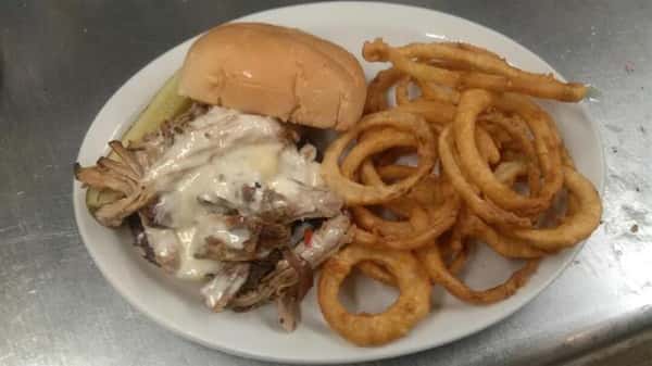 pulled pork sandwich with cheese and onion rings