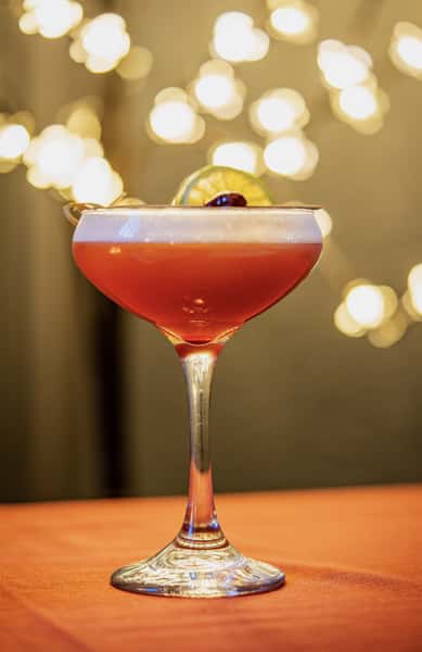 Specialty cocktail with a citrus garnish
