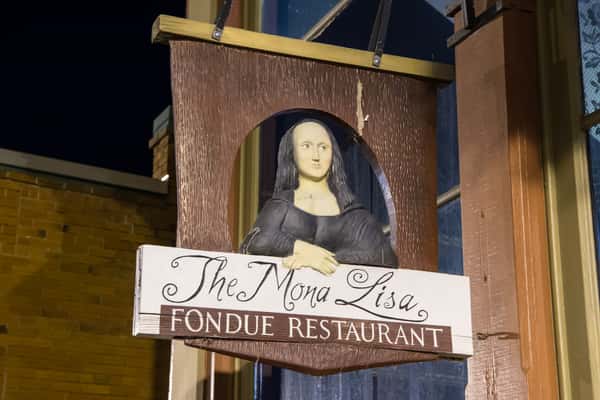 Front exterior sign for The Mona Lisa Fondue Restaurant