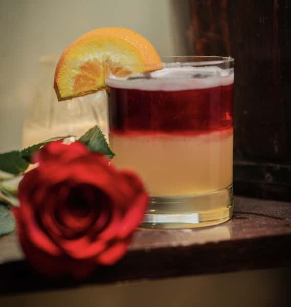 Cocktail with an orange slice garnish