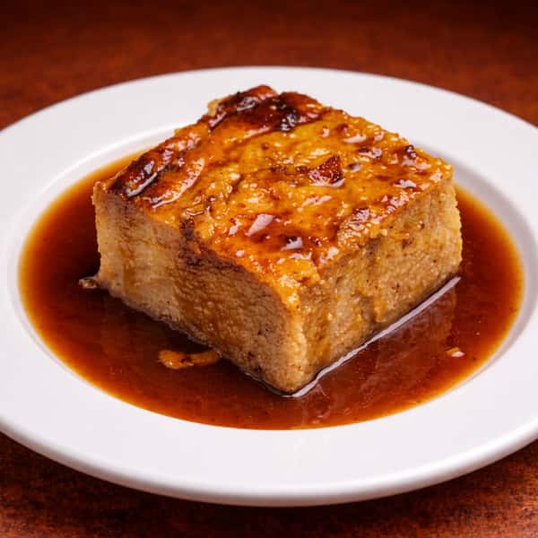 1/2 PAN BREAD PUDDING W/ RUM SAUCE