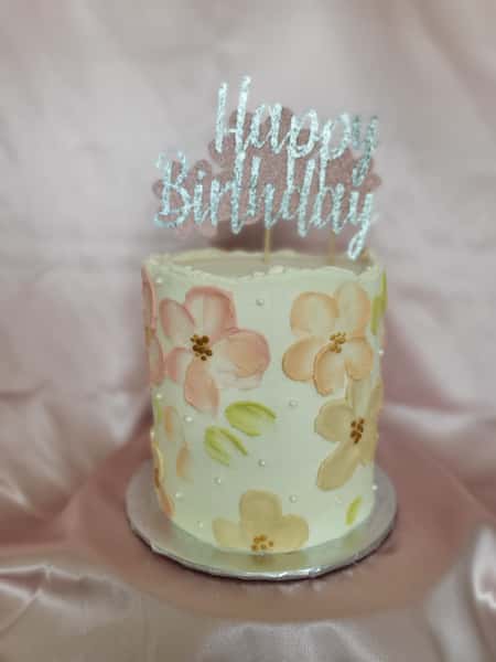 birthday cake with pink and yellow flowers