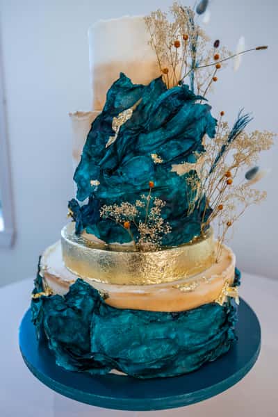 artistic cake with blue and gold