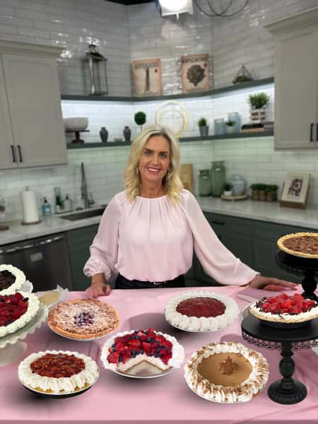Cheryl, owner of PIEfection, with a variety of pies in the kitchen