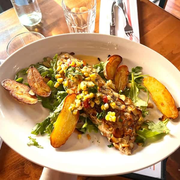 Our Truite Aux Amandes is the perfect way to enjoy trout. Local Sunburst Farms trout encrusted with almonds, sauteed, with arugula salad, corn basil tomato composee, &  fingerling potatoes in a lemon-white wine butter reduction. 

#asheville #ashevillefood #eatlocal #828isgreat #avleats #avlbouchon #frenchcuisine #Asheville #frenchfood #frenchcomfortfood #ashevillerestaurant