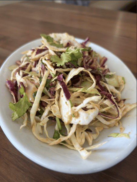 Fresh cabbage slaw with cilantro, red cabbage, and tangy dressing, light and colorful side dish