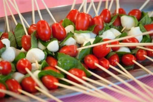 skewers of spinach, tomatoes and mozzarella balls