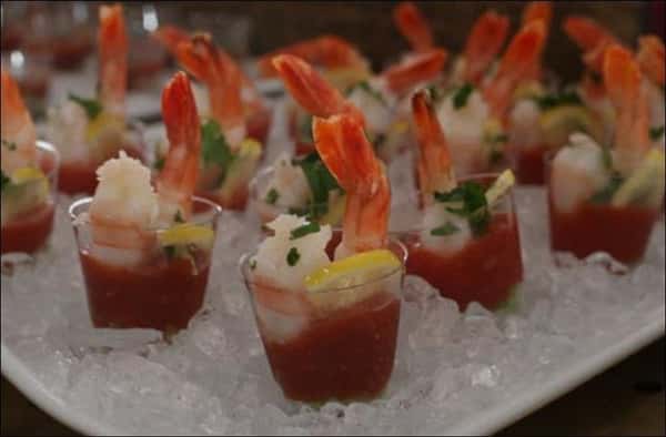 mini shot glasses filled with shrimp cocktails