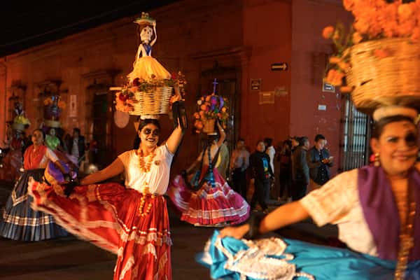 Day of the Dead night parade moving through the streets of Oaxaca, MX.