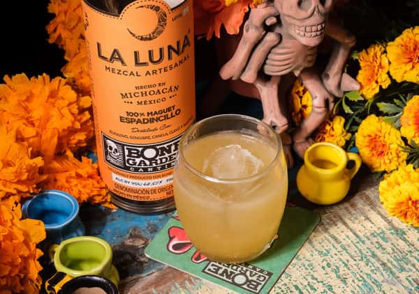 Peaches n' Bone cocktail features our custom Pechuga Mezcal made by La Luna in Michoacán, MX.