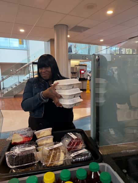 chef holding containers of food