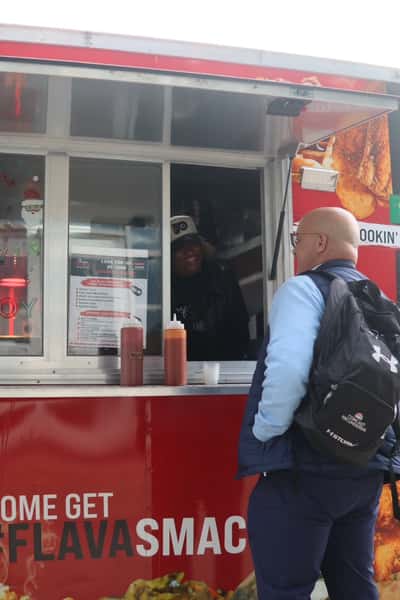 man ordering at food truck