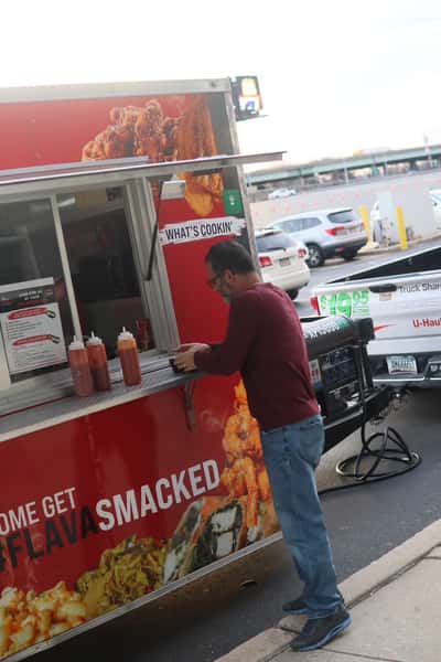 man ordering at food truck