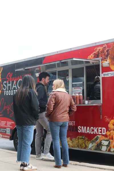 people ordering at the food truck