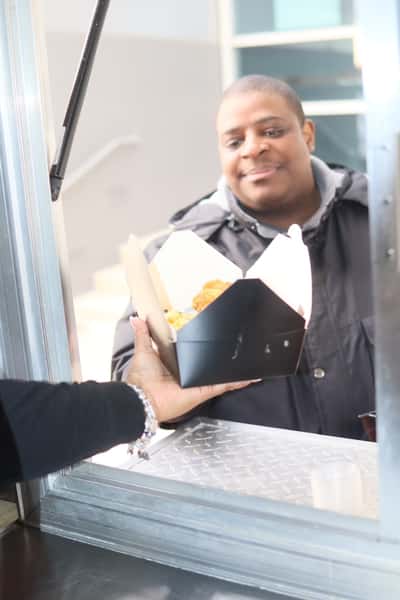man receiving food at food truck