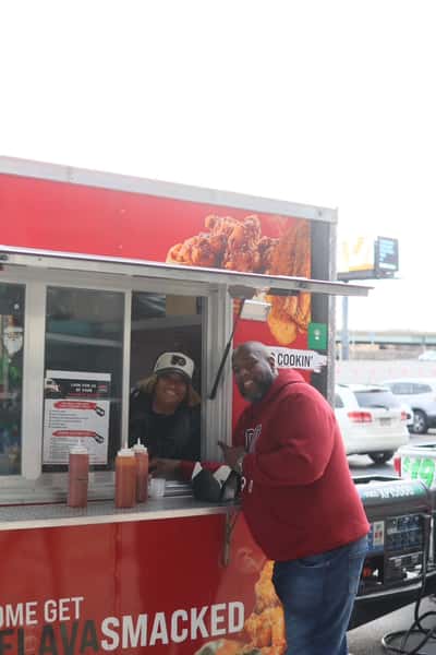 posing with chef next to food truck