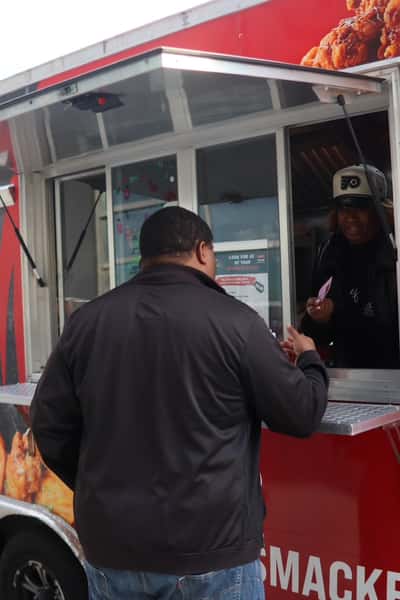 man ordering at food truck