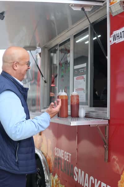 man ordering at food truck