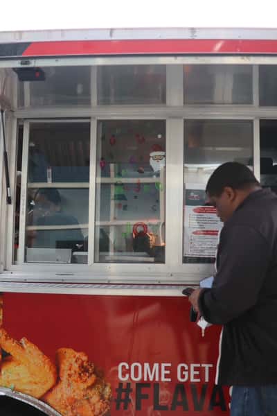 man ordering at food truck