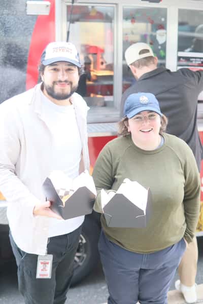 two people holding their food