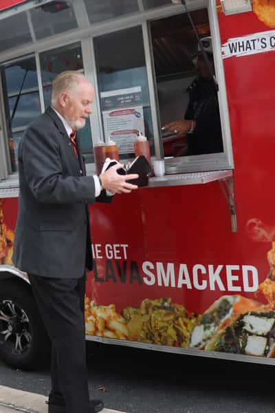 man receiving food at food truck