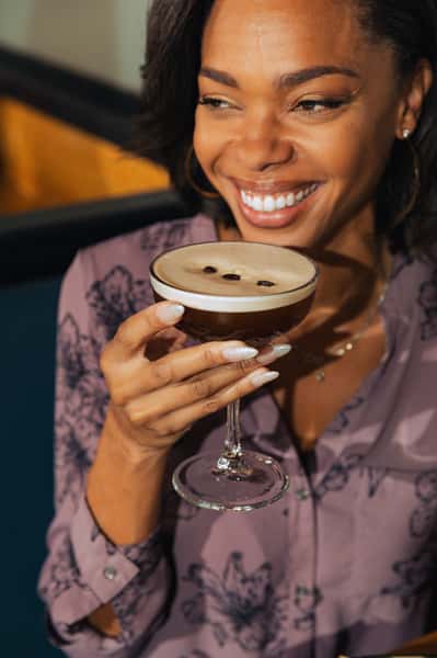 Woman enjoying an Espresso Martini