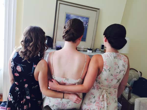3 girls with hair done looking away from the camera
