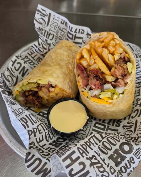 Brisket Smoke Show Burrito is what happens when chopped brisket, french fries, cheese, pickles, and onions meet Smoke Show BBQ and decide subtlety is overrated. 🌯🔥 Inspired by the bold flavors of Del Norte, this burrito brings big attitude in every bite. #BrisketSmokeShowBurrito #ColoradoGrille #BBQLovers #BurritoObsessed