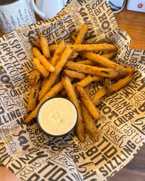 Spicy Pickles Fries are the kind of bold, briny trouble worth getting into 😏 Crispy, craveable, and served with green chili ranch for that extra kick, they're bringing big flavor to the table at Colorado Grille - Best Burgers in the San Luis Valley. 🔥 #ColoradoGrille #SpicyPicklesFries #BarAndGrill