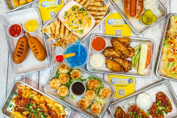 Group shot of food including chicken wings and more
