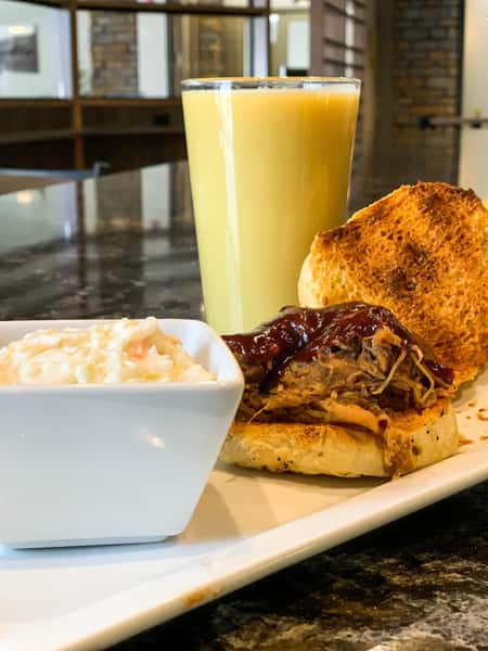pulled pork sandwich with a side of rice