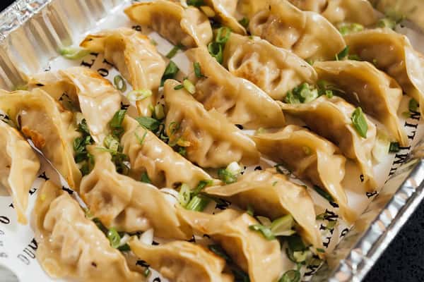 A catered pan full of dumplings
