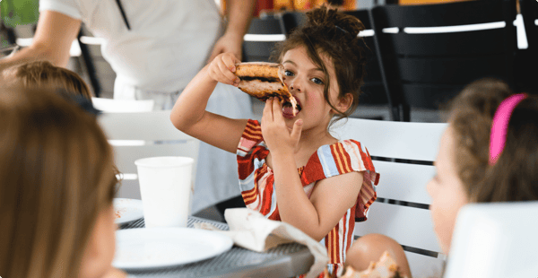 girl eating pizza