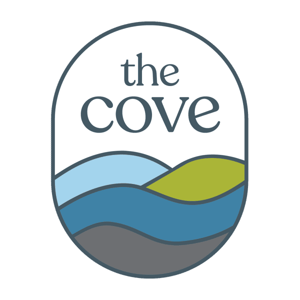 Oval shape logo of The Cove, with blue, green and grey colours.