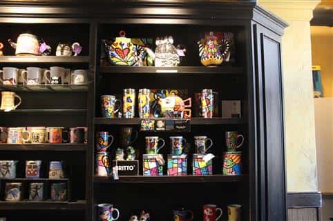 wall with a variety of coffee mugs