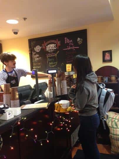 customers placing order with worker behind the counter