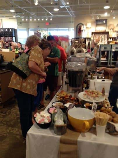 tables with items for sale with customers shopping