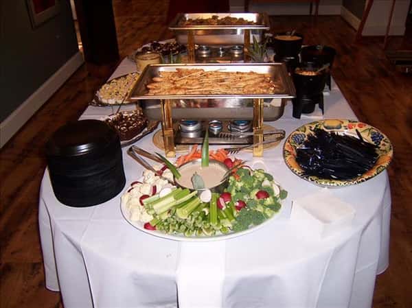 buffet table with vegetables and dipping sauce
