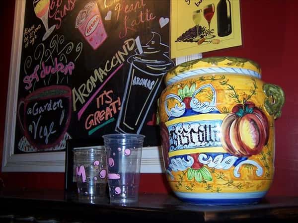 a big jar with a menu on a chalkboard