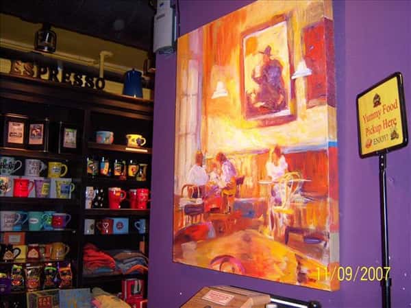 inside aromas with a painting on the wall