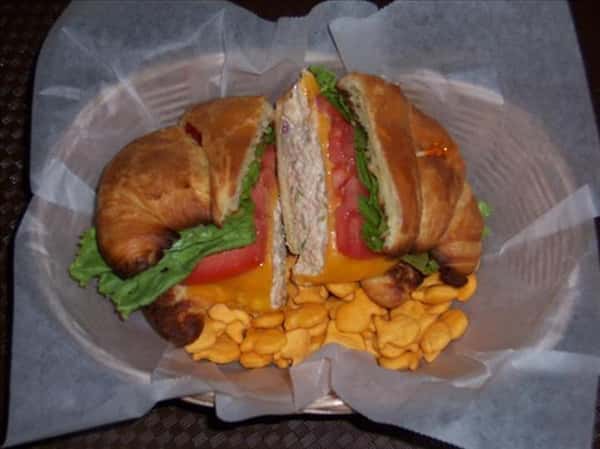 chicken salad on a croissant with goldfish crackers