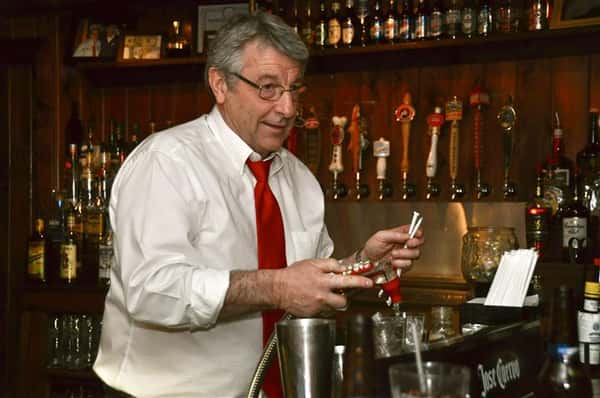 Bartender pouring a soft drink.