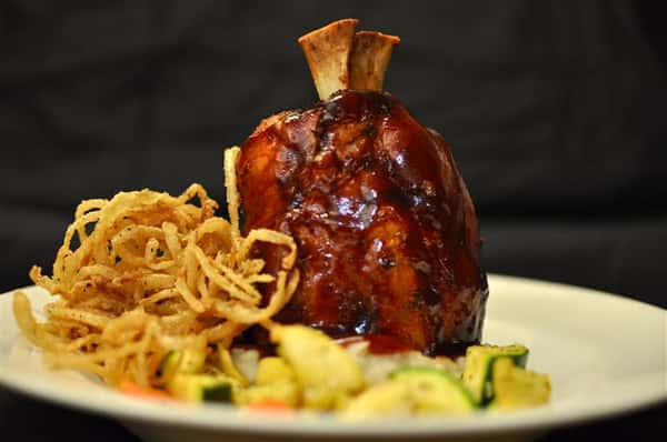 Slow-roasted flash fried shank with a Deer Fly IPA BBQ Glaze & haystack onions served over red skin mashed potatoes.