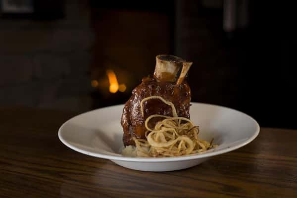 Slow-roasted flash fried shank with a Deer Fly IPA BBQ Glaze & haystack onions served over red skin mashed potatoes.