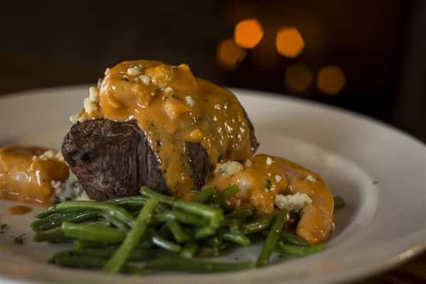 Grilled beef tenderloin and sauteed shrimp with Buffalo bleu cheese cream sauce served over red skinned mashed potatoes.