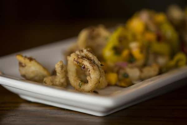 Fried Calamari tossed with roasted red peppers, banana peppers, topped with mango salsa & a balsamic drizzle.