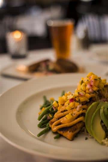 opped with avocado, mango salsa and lemon chipotle aioli served with rice pilaf.