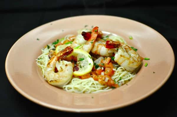 Shrimp & Lobster Alfredo with a creamy garlic Parmesan sauce tossed with fresh fettuccine pasta.