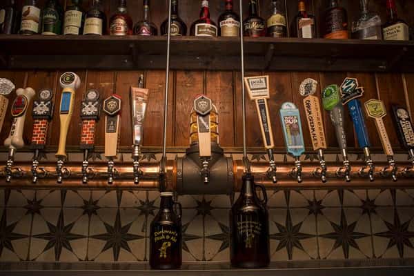 View behind the bar of beer tap.